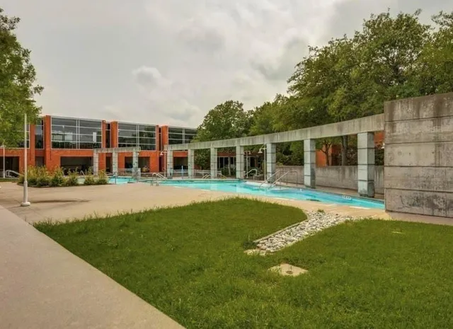 a childrens park with lots of swings and slides