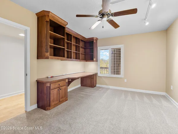 a bathroom with a double vanity sink a toilet and a mirror