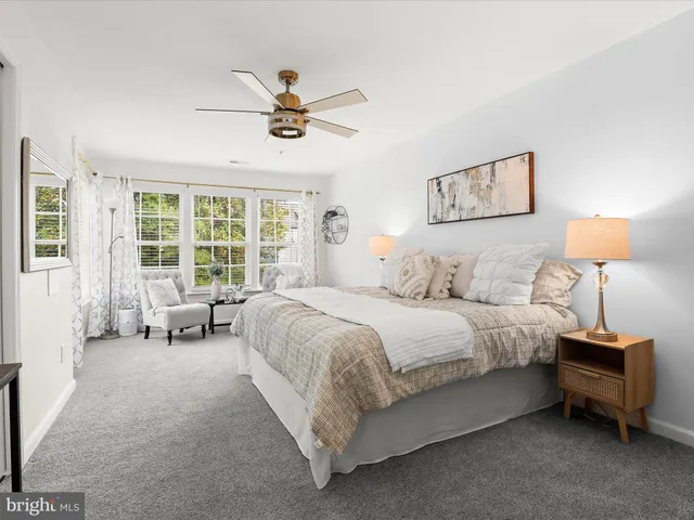 a bed room with a bed and a window