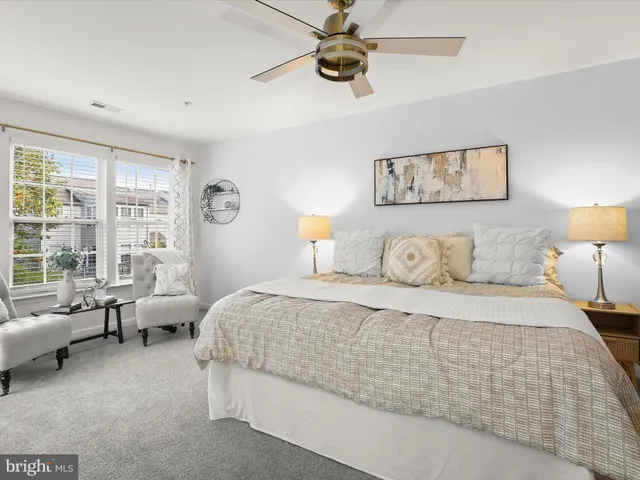 a bedroom with bed and window