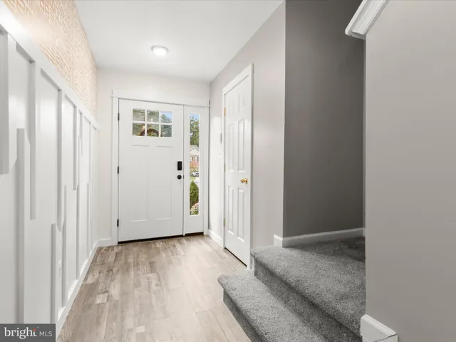 a view of entryway with wooden floor