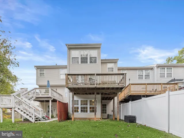 a view of a house with a backyard space