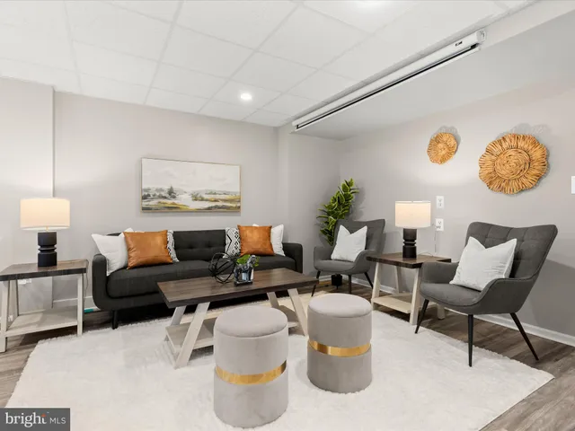 a living room with furniture and a table