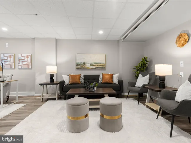 a living room with furniture and a table