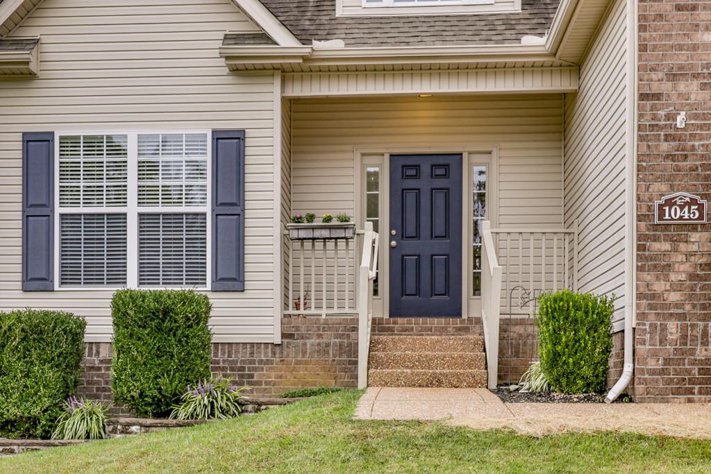 1045 Golf View Way Spring Hill, TN 37174 - Photo 2 of 26 a front view of a house with garden