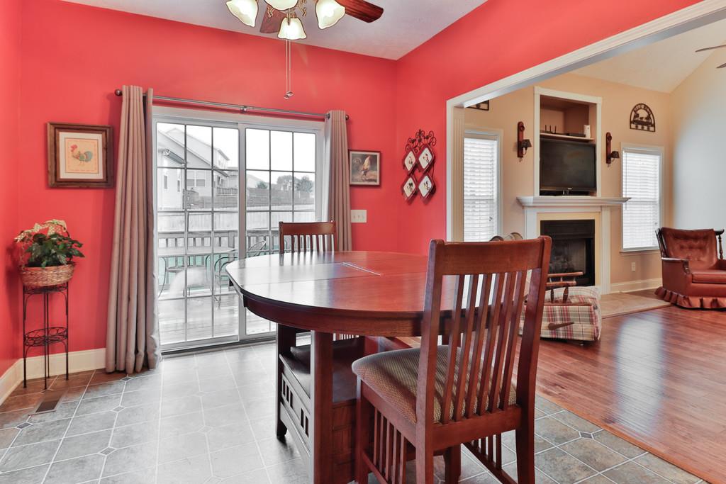 1045 Golf View Way Spring Hill, TN 37174 - Photo 13 of 26 a view of a dining room with furniture window and wooden floor