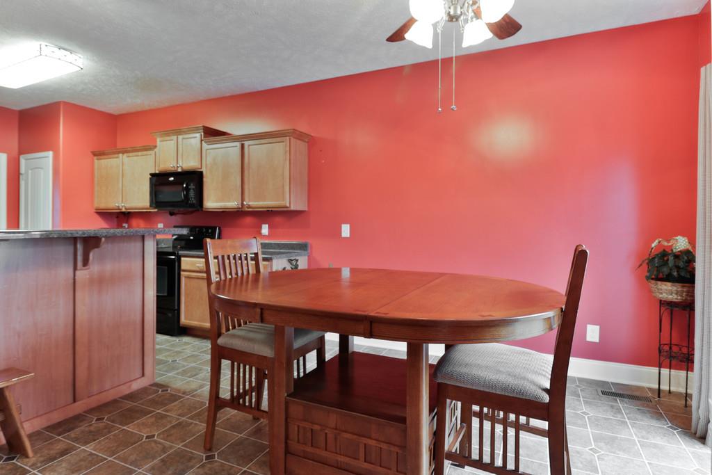 1045 Golf View Way Spring Hill, TN 37174 - Photo 14 of 26 a view of a dining room with furniture and wooden floor