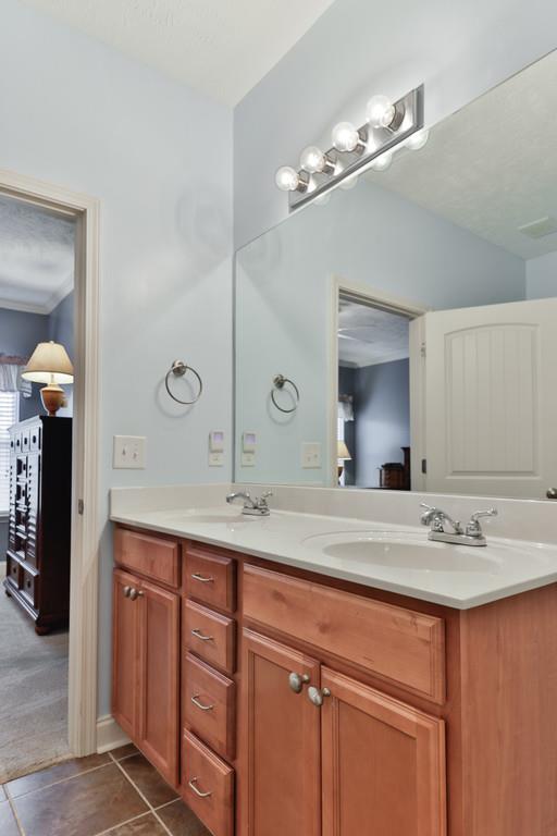 1045 Golf View Way Spring Hill, TN 37174 - Photo 18 of 26 a bathroom with a sink double vanity and a mirror