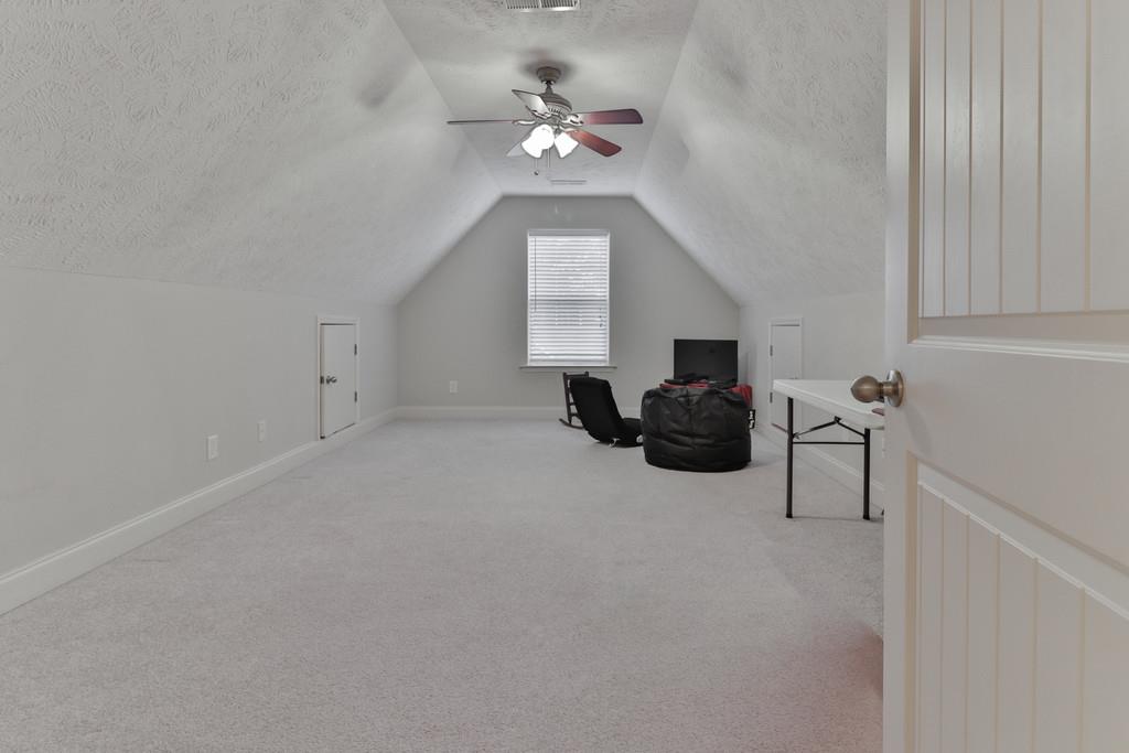 1045 Golf View Way Spring Hill, TN 37174 - Photo 22 of 26 a living room with furniture and a chandelier