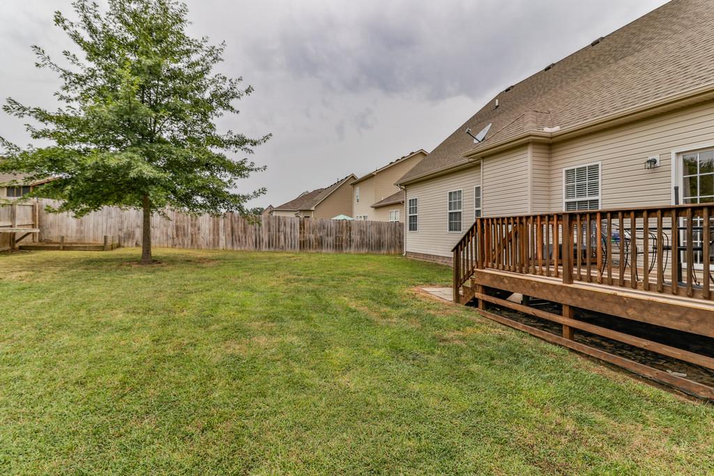 1045 Golf View Way Spring Hill, TN 37174 - Photo 25 of 26 a view of backyard with a garden and trees