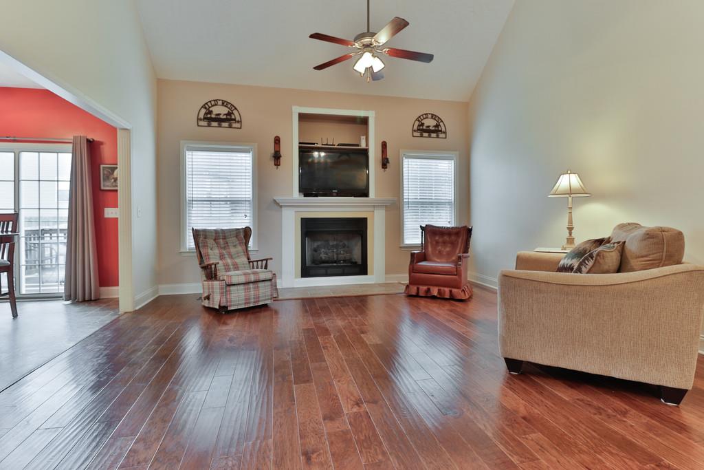 1045 Golf View Way Spring Hill, TN 37174 - Photo 4 of 26 a living room with furniture and a fireplace