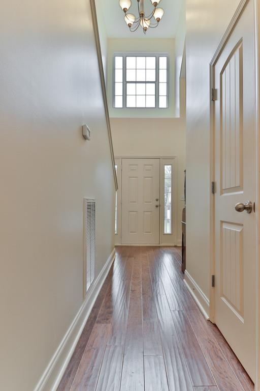 1045 Golf View Way Spring Hill, TN 37174 - Photo 8 of 26 wooden floor in an empty room with a window
