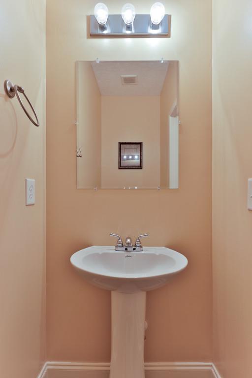 1045 Golf View Way Spring Hill, TN 37174 - Photo 9 of 26 a bathroom with a sink and a mirror