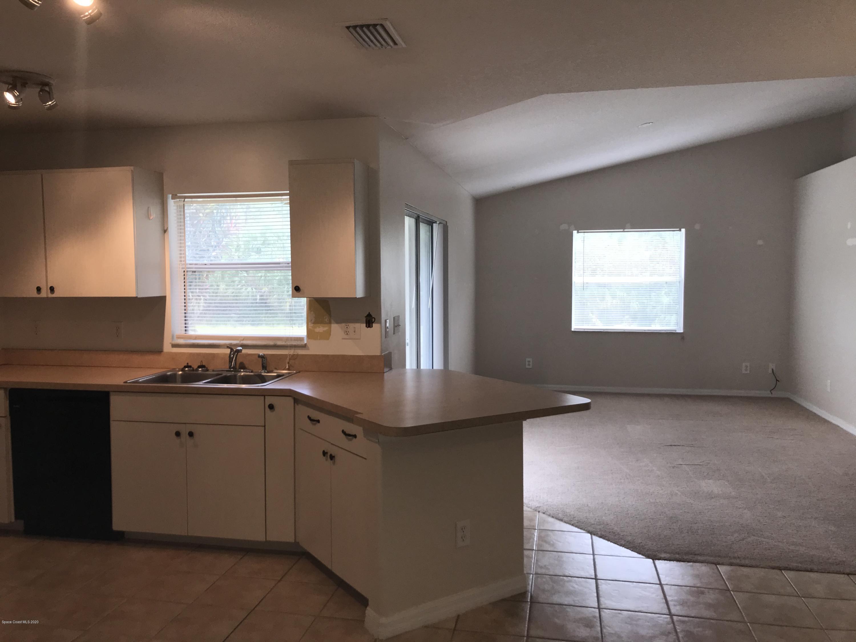 524 Titan Road Southeast Palm Bay, FL 32909 - Photo 6 of 18 a kitchen with sink and window