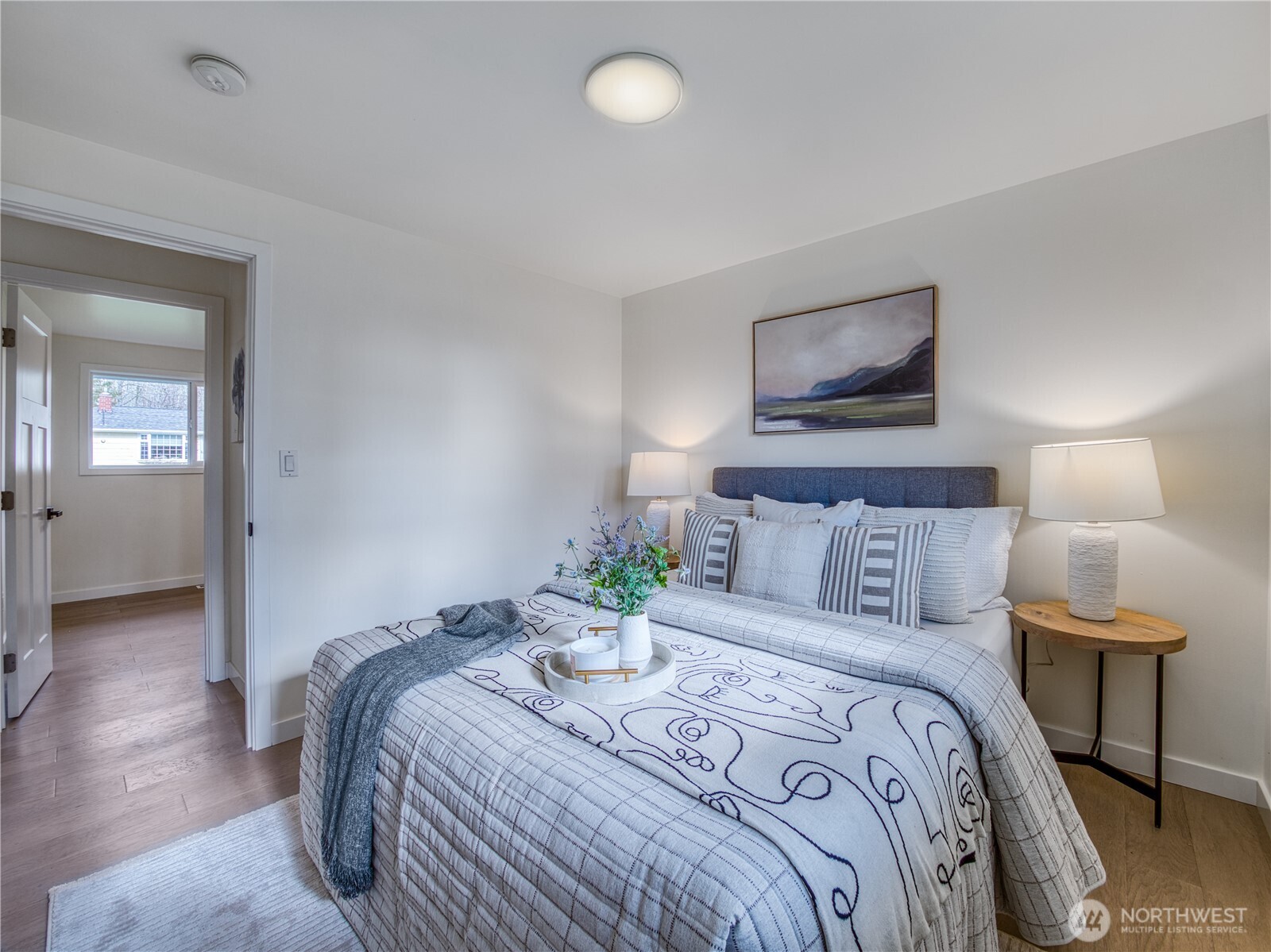 18 232nd Place Southwest Bothell, WA 98021 - Photo 19 of 32 a bedroom with a bed and a lamp