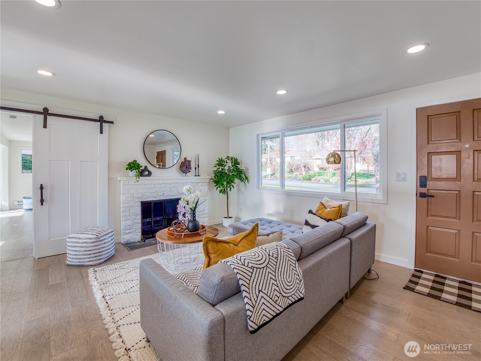18 232nd Place Southwest Bothell, WA 98021 - Photo 3 of 32 a living room with fireplace furniture and a wooden floor