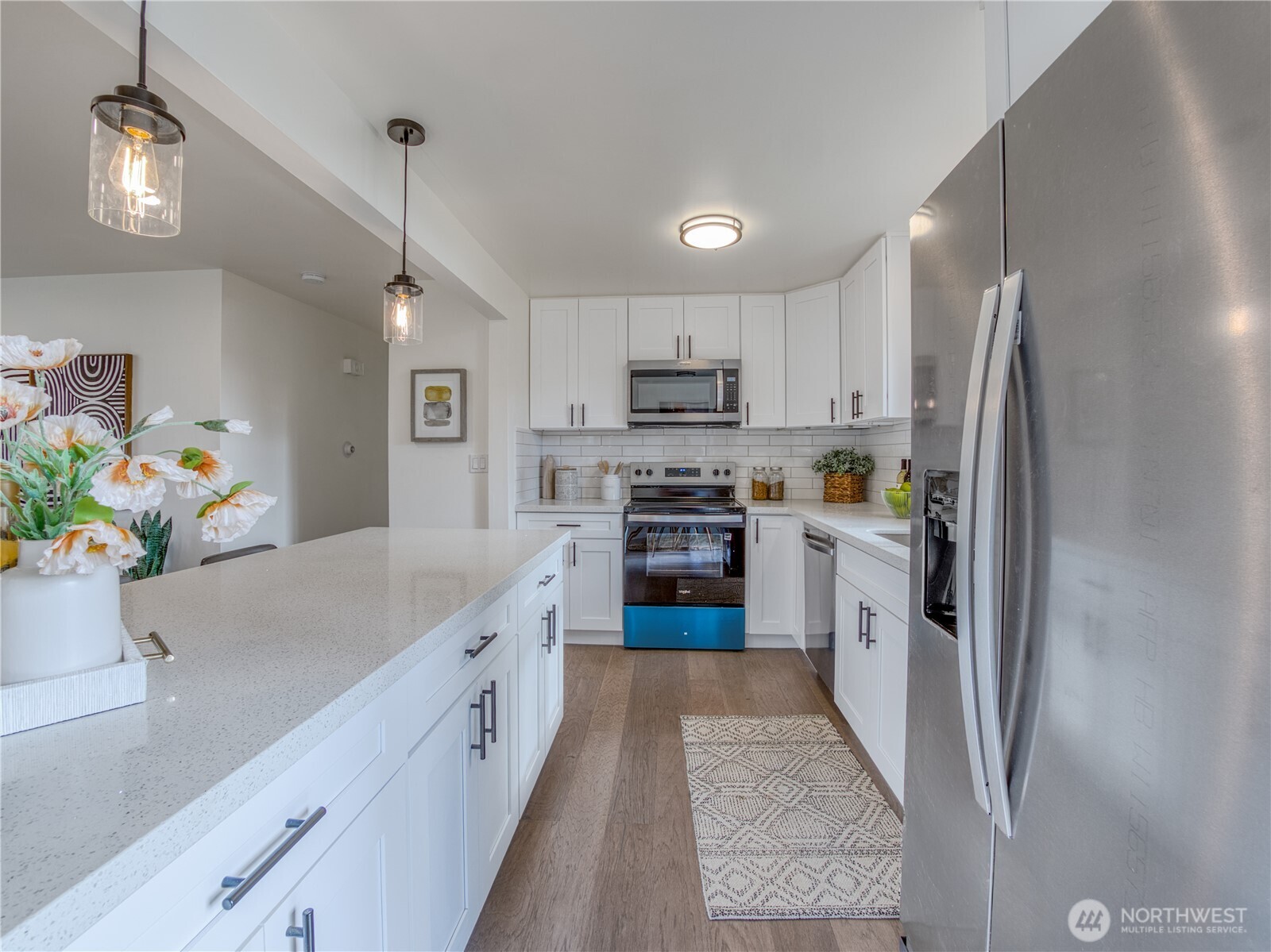 18 232nd Place Southwest Bothell, WA 98021 - Photo 8 of 32 a kitchen with kitchen island a counter top space stainless steel appliances and cabinets