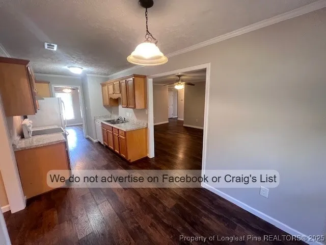 a view of a room with wooden floor and lounge chair