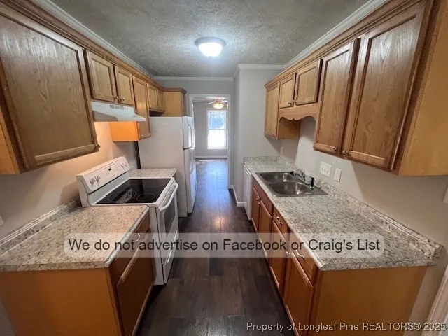 a kitchen with stove and refrigerator