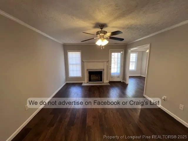 wooden floor in an empty room with a fireplace