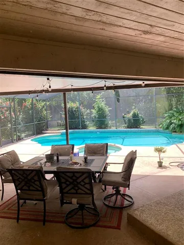 a backyard of a house with outdoor seating