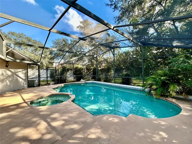 a view of a backyard with a small pool