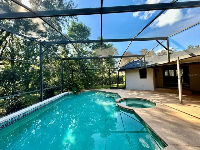 a view of a backyard and sitting area