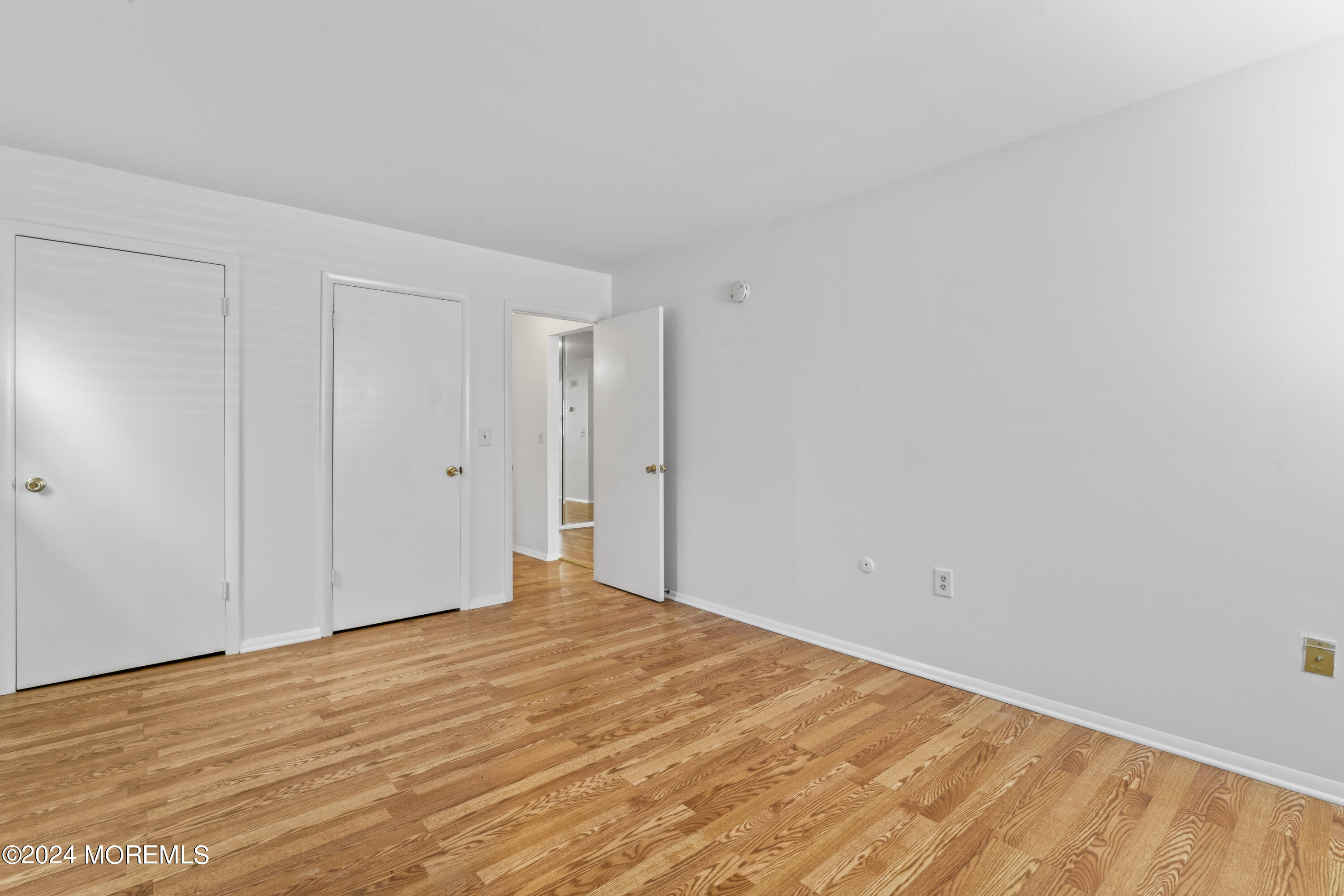 601 Mistletoe Avenue, Unit 4 Point Pleasant, NJ 08742 - Photo 11 of 28 a view of empty room with wooden floor