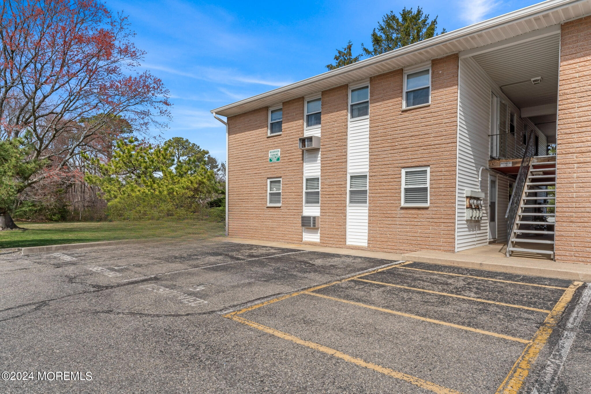 601 Mistletoe Avenue, Unit 4 Point Pleasant, NJ 08742 - Photo 14 of 28 a front view of a house with a yard and garage