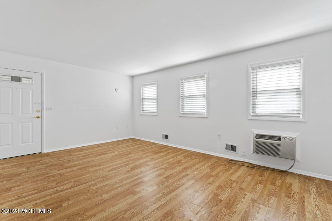 601 Mistletoe Avenue, Unit 4 Point Pleasant, NJ 08742 - Photo 16 of 28 a view of empty room with wooden floor and fan