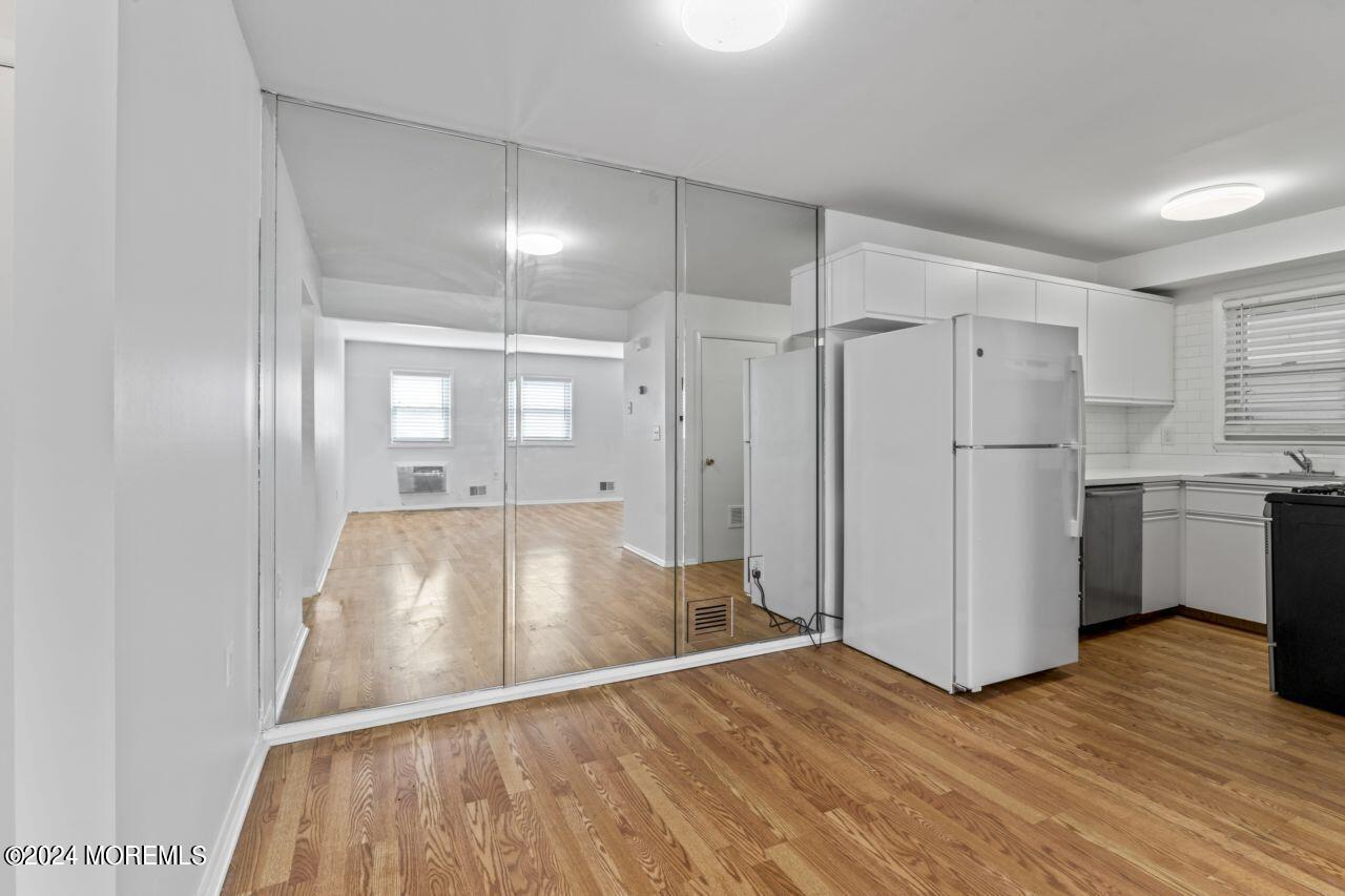 601 Mistletoe Avenue, Unit 4 Point Pleasant, NJ 08742 - Photo 21 of 28 a view of a kitchen with a fridge and wooden floor