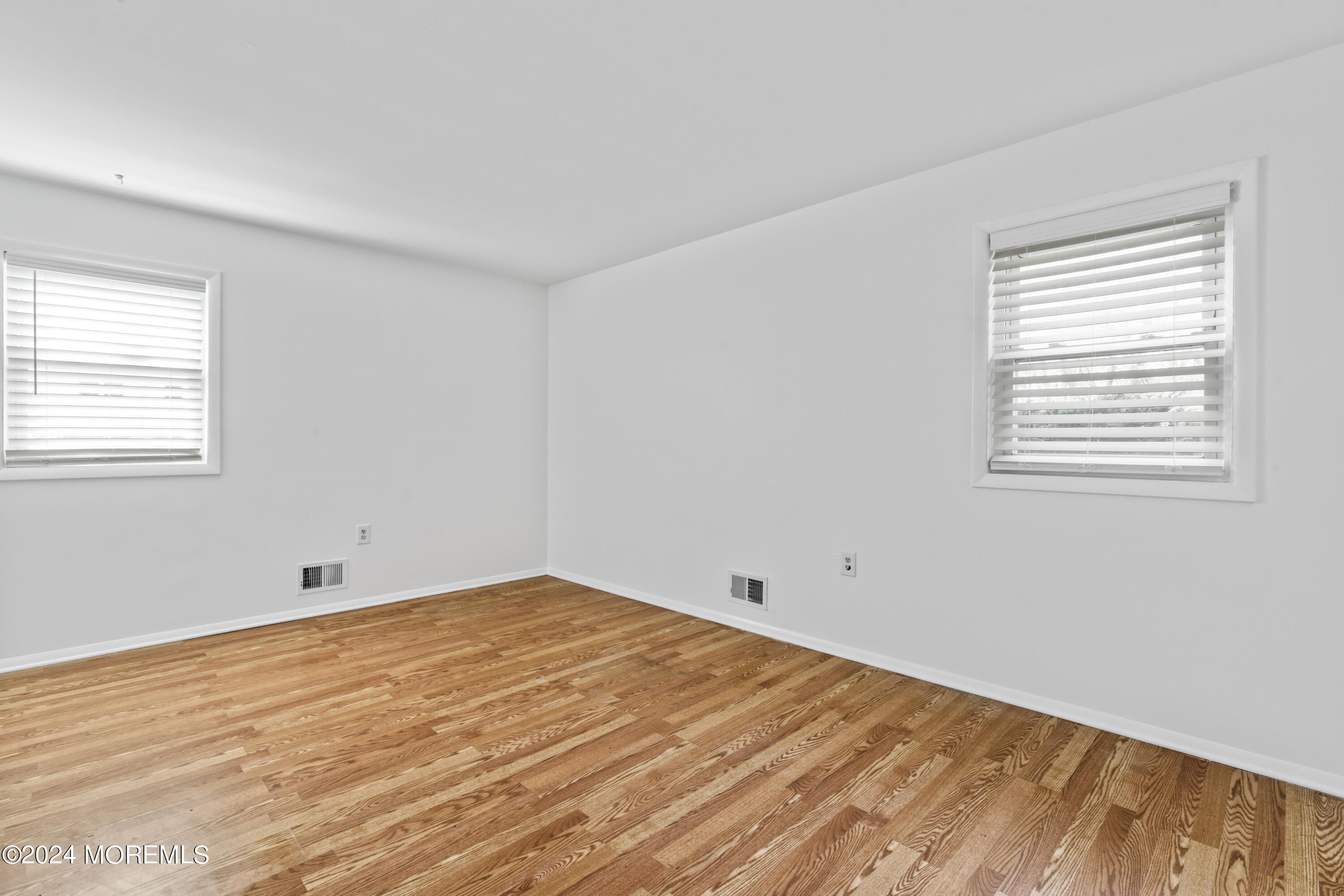 601 Mistletoe Avenue, Unit 4 Point Pleasant, NJ 08742 - Photo 10 of 28 a view of empty room with wooden floor and fan