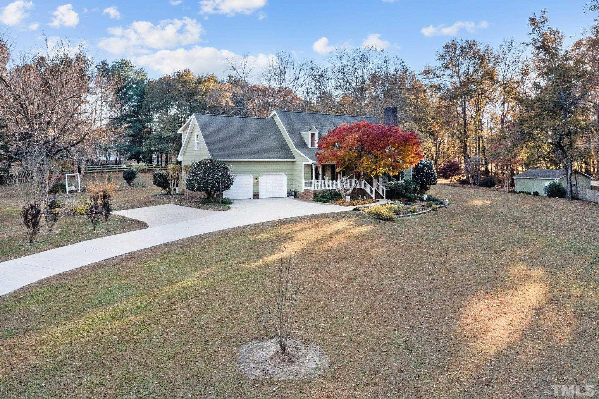 924 Windrow Lane Raleigh, NC 27603 - Photo 23 of 26 a view of a house with a yard and covered with snow