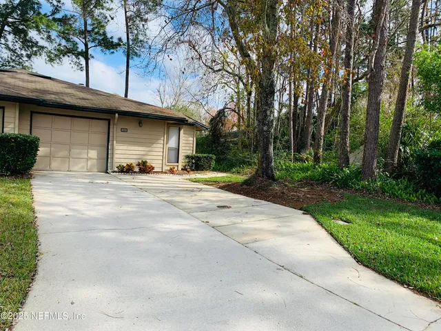 a house with trees in front of it