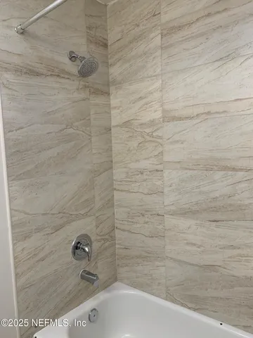a bathroom with a bathtub