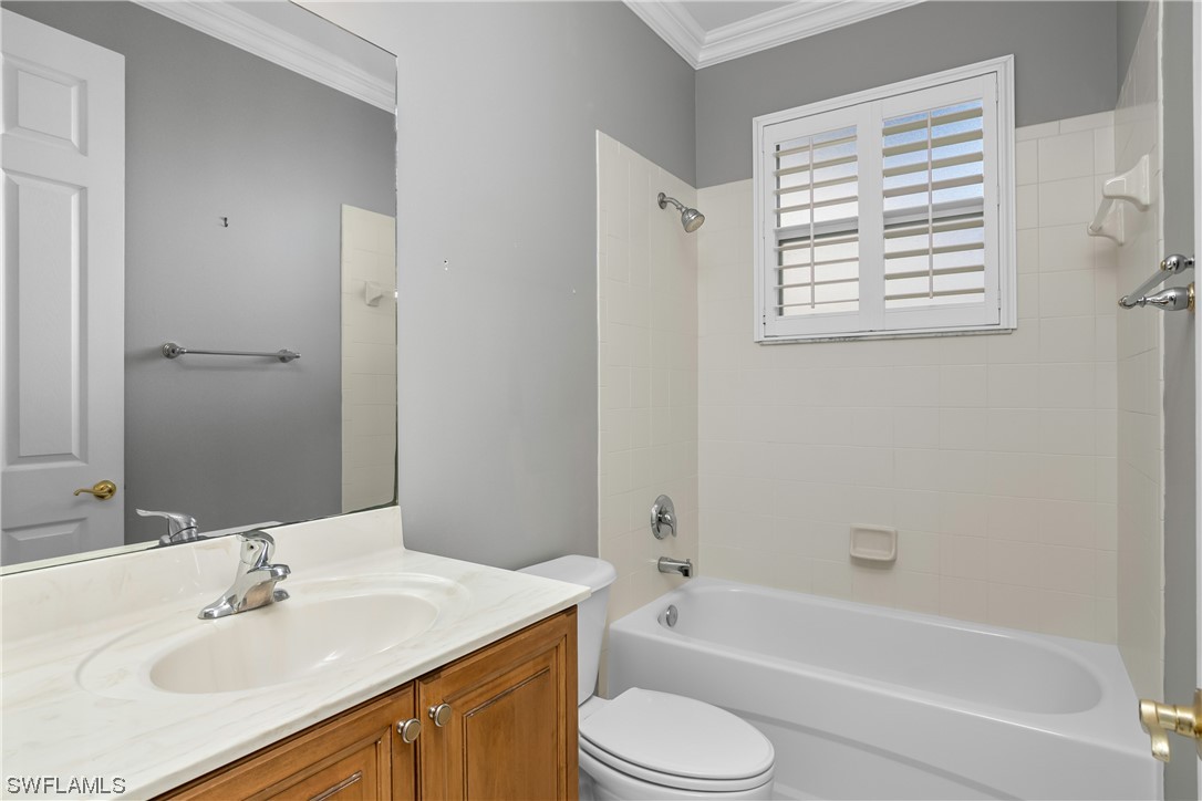 9057 Whitfield Drive Estero, FL 33928 - Photo 22 of 28 a bathroom with a sink toilet and bathtub