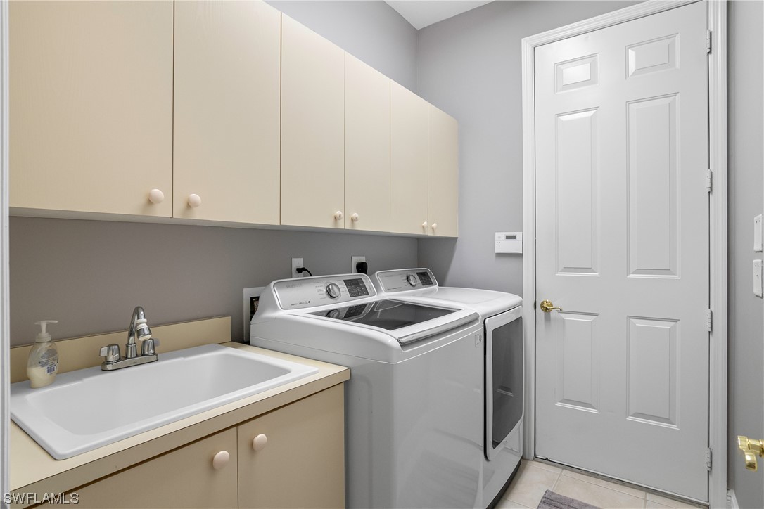 9057 Whitfield Drive Estero, FL 33928 - Photo 24 of 28 a utility room with dryer and washer