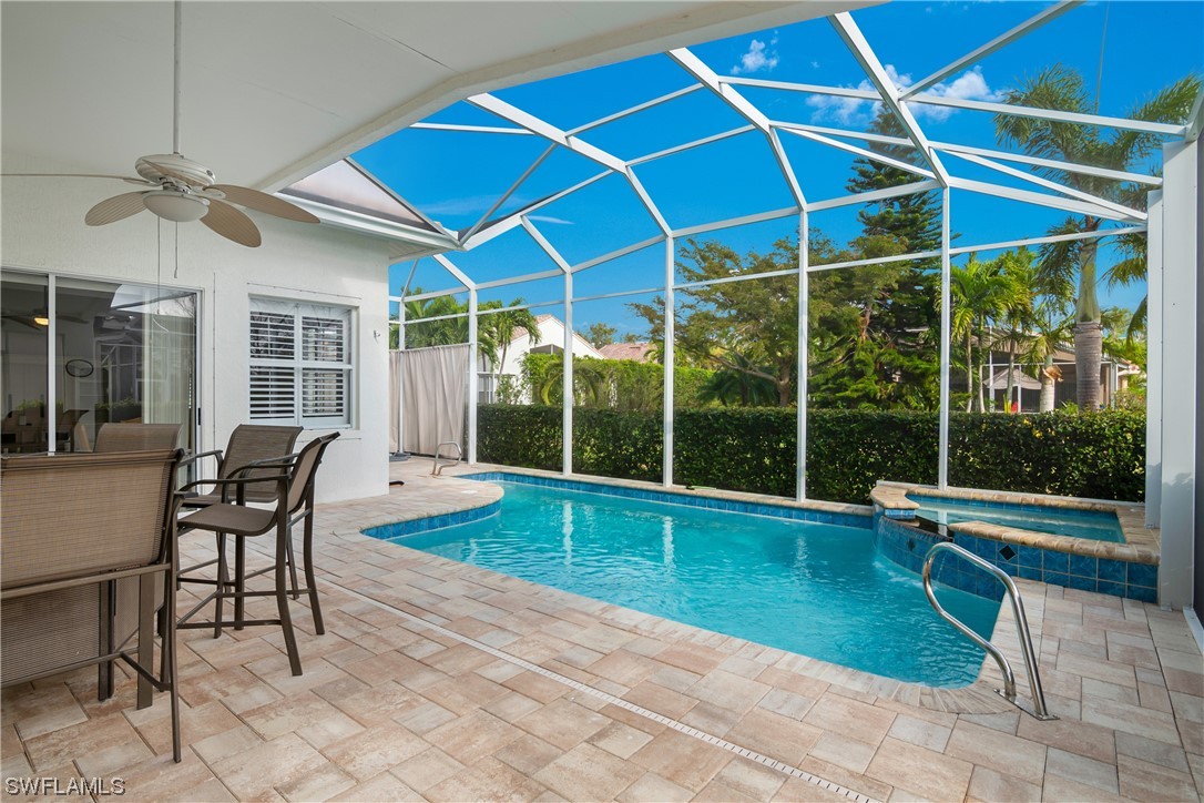 9057 Whitfield Drive Estero, FL 33928 - Photo 27 of 28 a view of a house with backyard porch and sitting area
