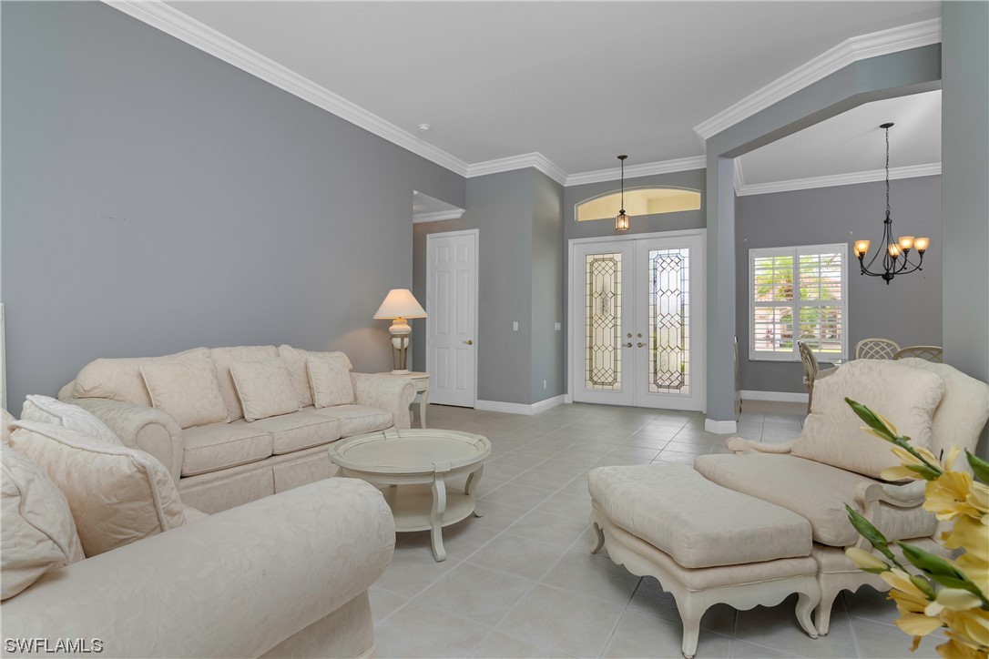 9057 Whitfield Drive Estero, FL 33928 - Photo 4 of 28 a living room with furniture and a large window