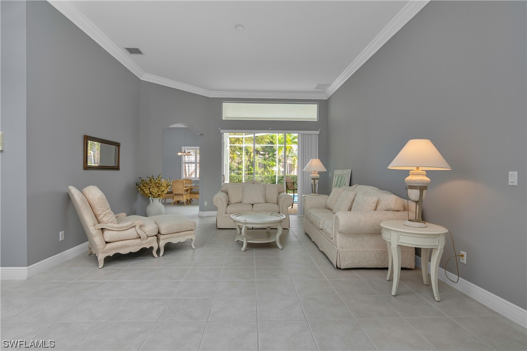 9057 Whitfield Drive Estero, FL 33928 - Photo 5 of 28 a living room with furniture and a window