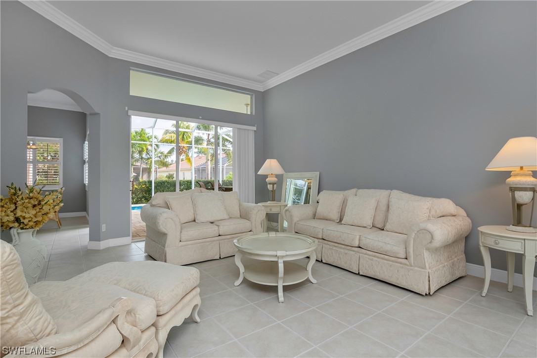 9057 Whitfield Drive Estero, FL 33928 - Photo 6 of 28 a living room with furniture and a large window
