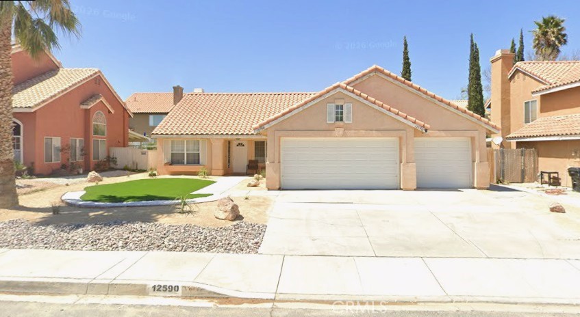 12590 Cobalt Road Victorville, CA 92392 - Photo 1 of 37 a view of a house with a yard and large tree