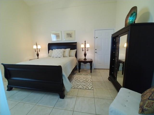 2670 Canaan Church Road Crawford, TX 76638 - Photo 13 of 17 a bedroom with a bed and a lamp