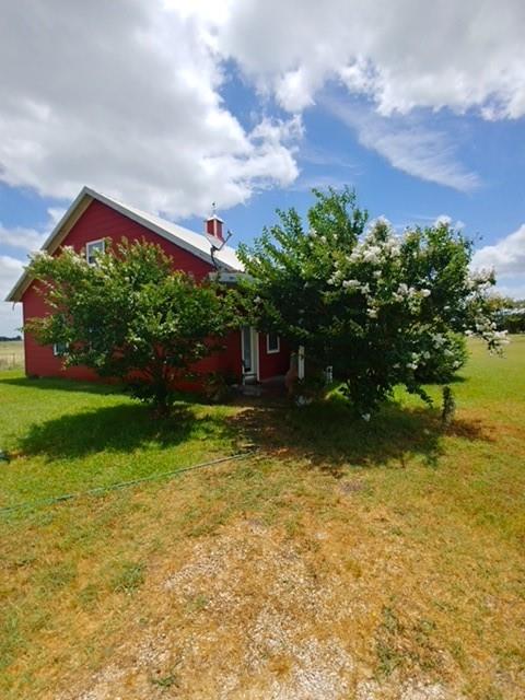 2670 Canaan Church Road Crawford, TX 76638 - Photo 16 of 17 a front view of a house with a yard