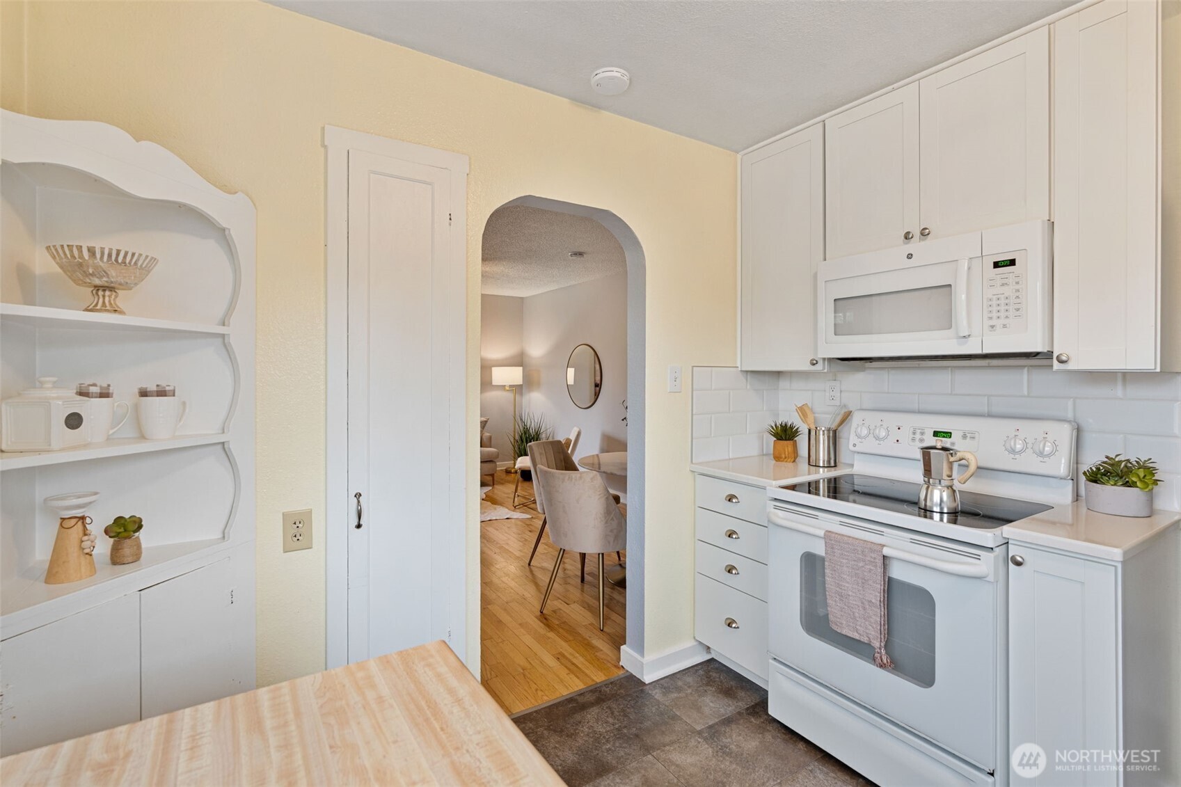 1027 South Rochester Street Tacoma, WA 98465 - Photo 13 of 29 a view of cabinets a sink and dishwasher in a white cabinet