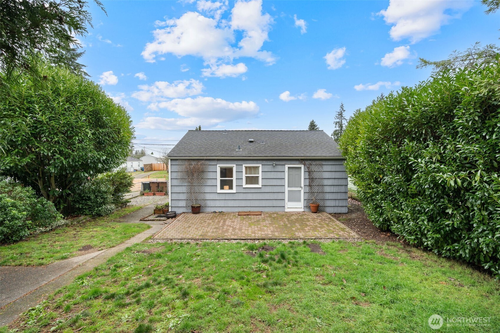 1027 South Rochester Street Tacoma, WA 98465 - Photo 19 of 29 a house view with a garden space