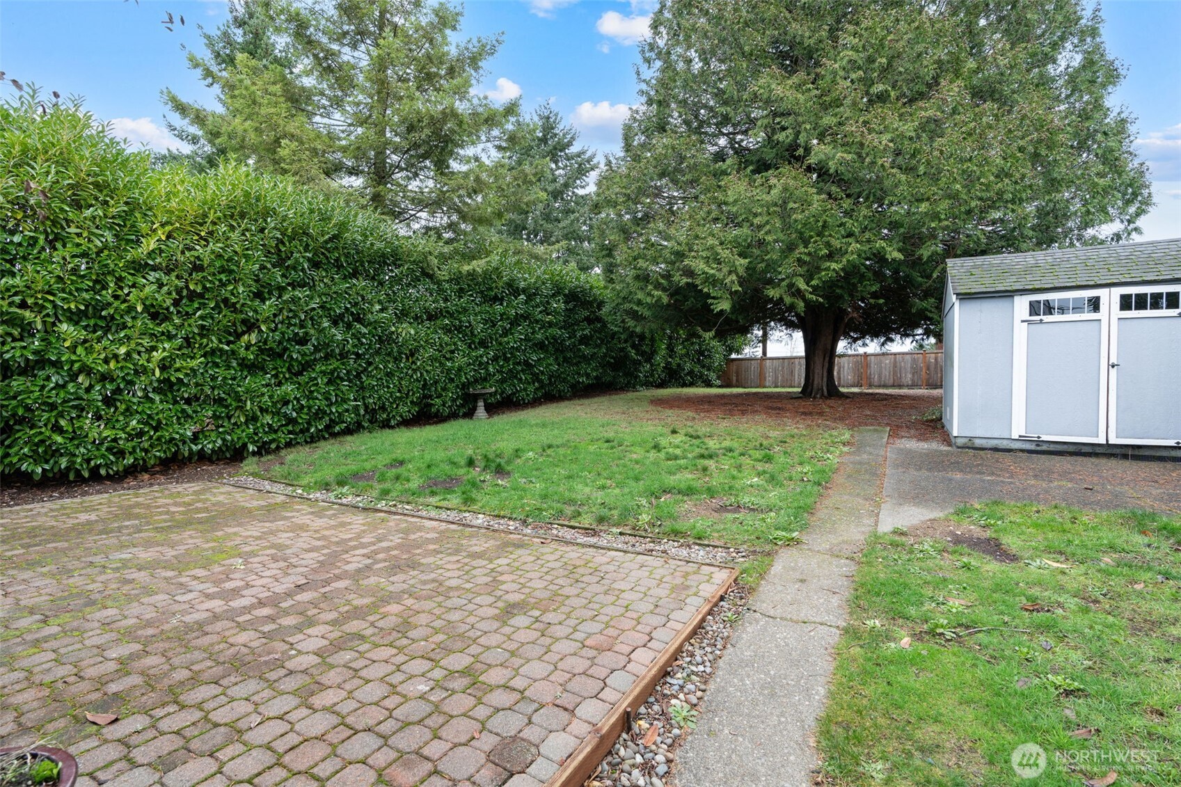 1027 South Rochester Street Tacoma, WA 98465 - Photo 22 of 29 a view of a house with a yard