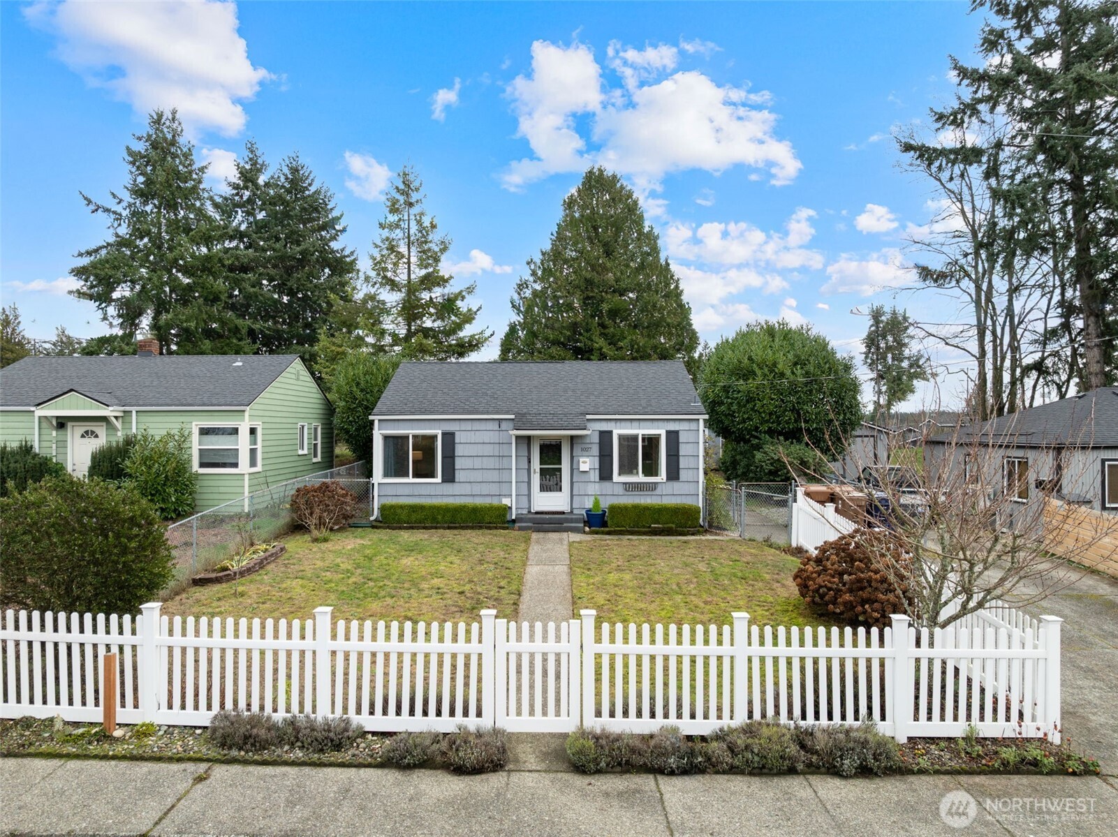 1027 South Rochester Street Tacoma, WA 98465 - Photo 23 of 29 front view of a house with a fence
