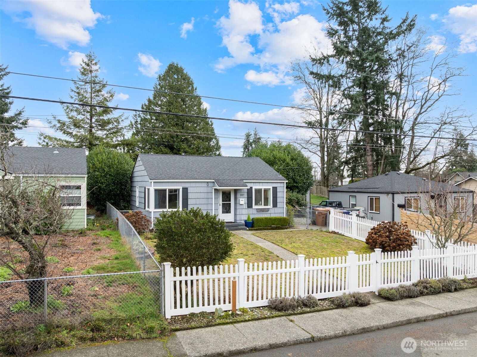 1027 South Rochester Street Tacoma, WA 98465 - Photo 25 of 29 a front view of a house with a garden
