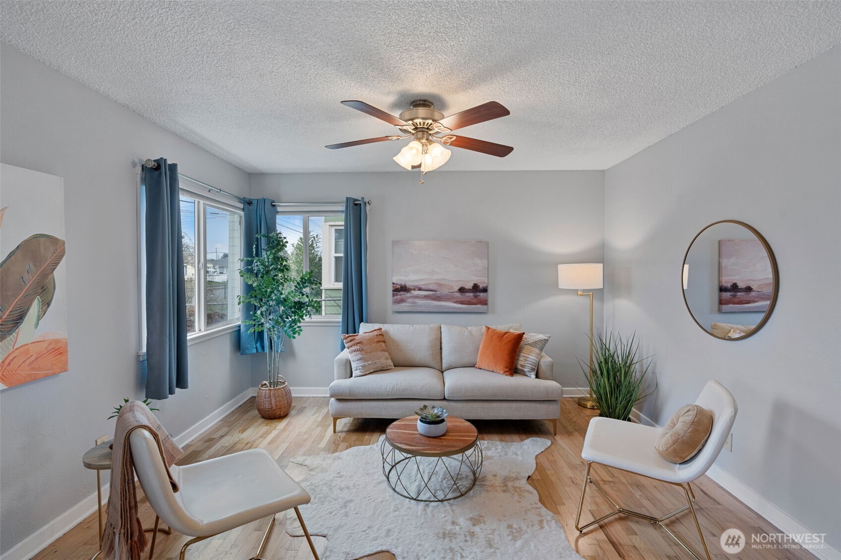 1027 South Rochester Street Tacoma, WA 98465 - Photo 5 of 29 a living room with furniture a chandelier and a window